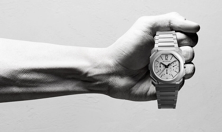 The ultra-thin Bvlgari Octo Finissimo Chronograph GMT Automatic sandblasted titanium watch, creative shot.