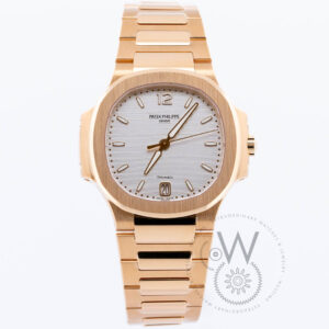 Patek Philippe, Nautilus, Selfwinding, 35.2mm Rose Gold Case and Bracelet, Silvery Opaline Dial, Foldover Clasp, "Tiffany & Co" above date window at 6 o'clock 7118/1R-001