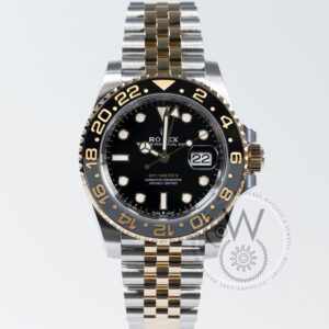 Rolex GMT-Master II 126713GRNR with gold steel case, black dial, and black bezel