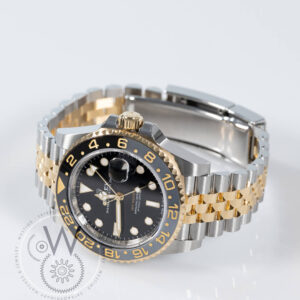 Rolex GMT-Master II 126713GRNR with gold steel case, black dial, and black bezel