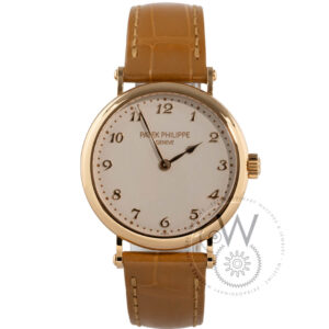 Patek Philippe Calatrava 7200R-001 with a 34.6mm rose gold case, cream dial, and light brown alligator strap.