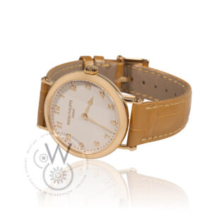 Patek Philippe Calatrava 7200R-001 with a 34.6mm rose gold case, cream dial, and light brown alligator strap.