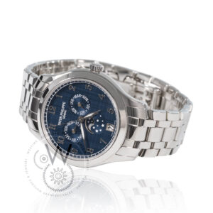 Patek Philippe 4947/1A-001 with a 38mm stainless steel case, blue dial, and steel bracelet.