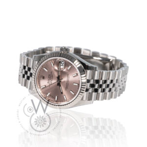 Rolex Datejust 31 278274 featuring a pink dial, white gold fluted bezel, and stainless steel case.