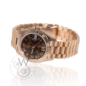 Rolex Lady-Datejust 278275, 31mm rose gold case with brown dial and rose gold fluted bezel.