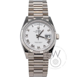 Rolex Day-Date 36 in white gold with fluted bezel, whitedial, and President bracelet.