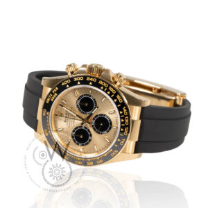 Rolex Daytona 126518LN with a yellow gold case, champagne dial, and black Cerachrom bezel on an Oysterflex bracelet.