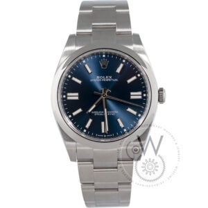 Rolex Oyster Perpetual 41 124300 with a blue dial, stainless steel case, and Oyster bracelet.