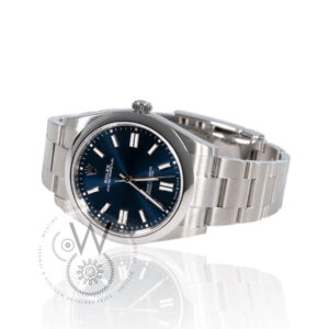 Rolex Oyster Perpetual 41 124300 with a blue dial, stainless steel case, and Oyster bracelet.