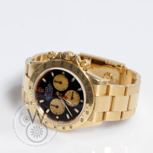 Rolex Daytona Ref. 116528 in yellow gold with black dial and champagne subdials on Oyster bracelet