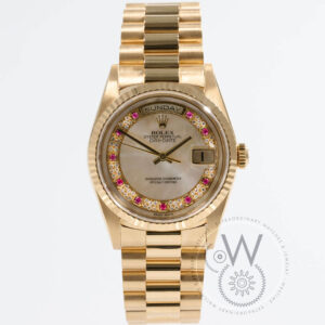 Rolex Day-Date 36 Ref. 18238 in 18k yellow gold with mother-of-pearl dial and ruby hour markers