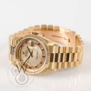 Rolex Day-Date 36 Ref. 18238 in 18k yellow gold with mother-of-pearl dial and ruby hour markers