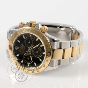 Rolex Daytona Ref. 116523 with black dial, yellow gold bezel, and two-tone steel and gold case