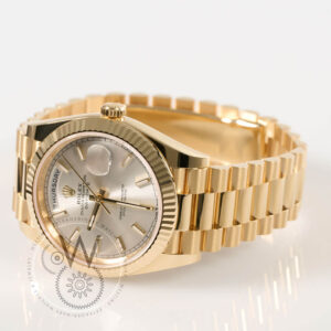 Rolex Day-Date 40 Ref. 228238 in 18k yellow gold with silver dial and fluted bezel